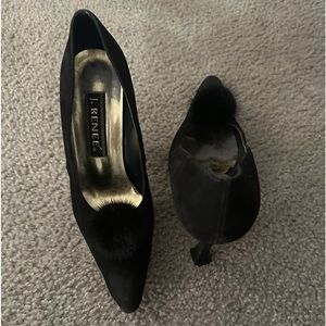 Black sued pumps with fur ball